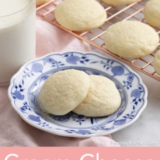 cream cheese cookies stacked on a plate