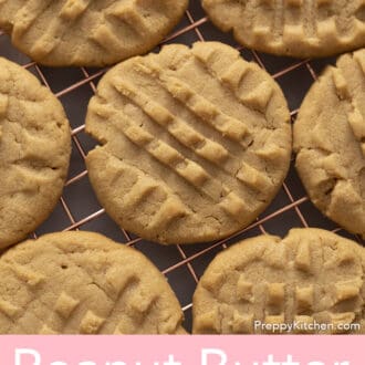 A top down photo of peanut butter cookies cooling on a wire rack.