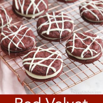 Pinterest graphic of red velvet cookies drizzled with white chocolate on a cooling rack.