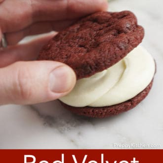 Pinterest graphic of a red velvet cookie with cream cheese frosting and another cookie added on top.