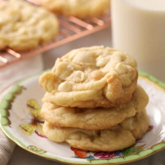 Pinterest graphic showing delicious white chocolate chip macadamia nut cookies on a porcelain plate.