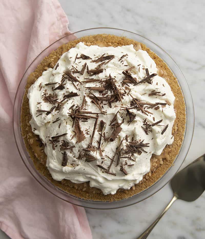 A top down shot of a banoffee pie on a marble table.