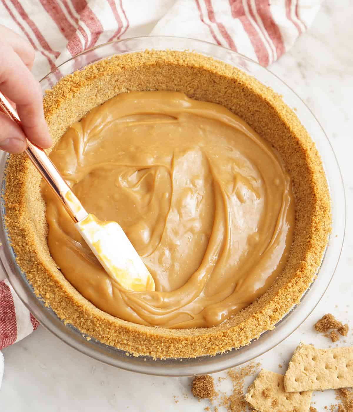 dDulce de leche in a pie crust for banoffee pie.