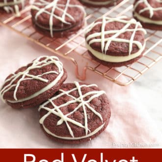 Pinterest graphic of red velvet cookies on a cooling rack with two more cookies in front.