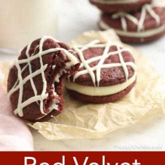 Pinterest graphic of red velvet cookies on a paper, drizzled with white chocolate.