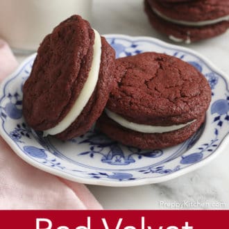 Pinterest graphic of two red velvet cookies on a plate.