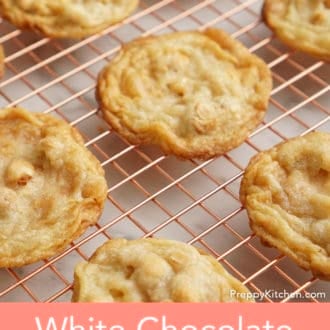 Pinterest graphic showing white chocolate macadamia cookies on a cooling rack.