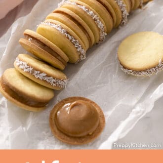 Pinterest graphic of a stack of alfajores on parchment paper.