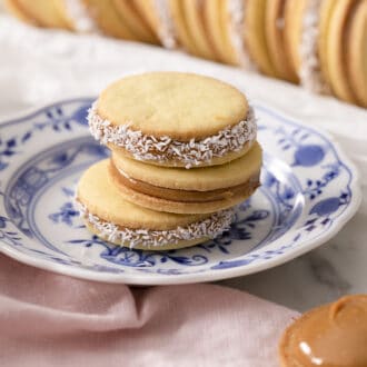 Pinterest graphic of three alfajores cookies on a plate.