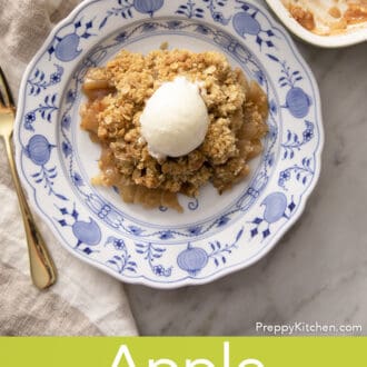 Pinterest graphic of an overhead view of apple crisp topped with a scoop of vanilla ice cream.