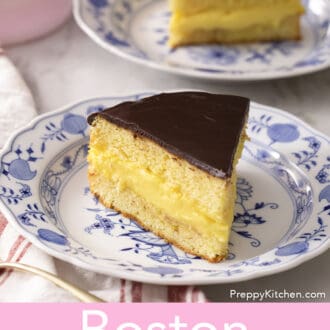 Two pieces of Boston cream pie on blue and white plates.