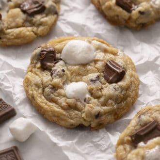 A smores cookie topped with marshmallow and chocolate.
