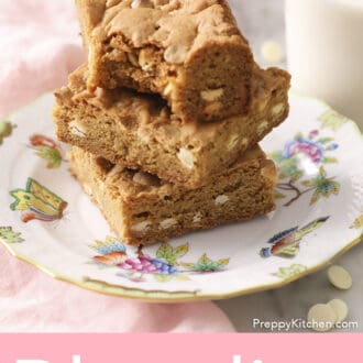 A stack of blondies with a bite taken out of the top.