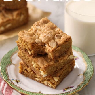 Pinterest graphic of three blondies on a green and white porcelain plate next to a glass of milk.