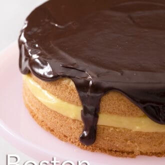 A Boston cream pie with drips of chocolate ganache.
