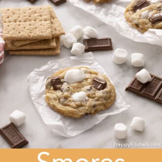 A s'mores cookie on parchment paper next to Graham crackers.
