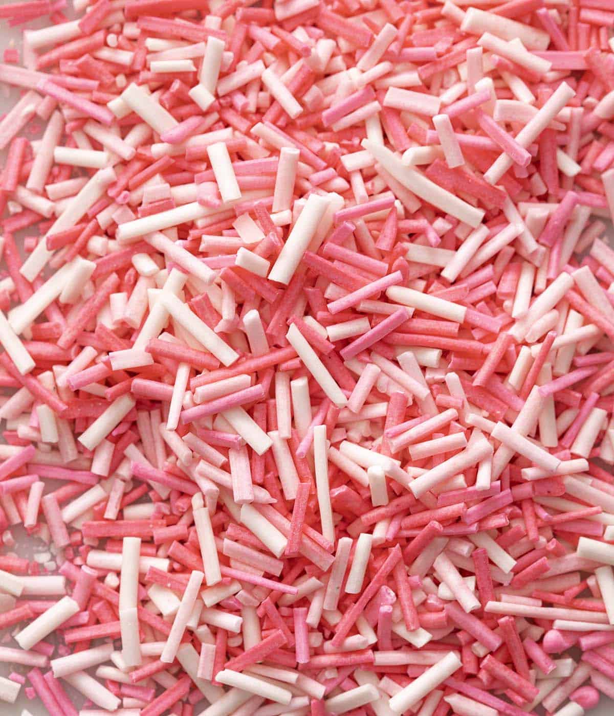 Three different colored homemade sprinkles mixed together.