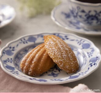 Pinterest graphic of two Madeleines next to a cup of tea.