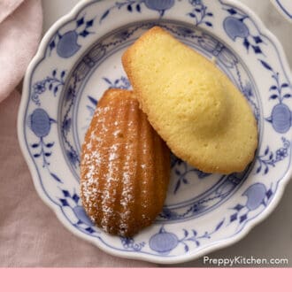 Pinterest graphic of two Madeleines on a blue and white plate.