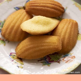 Pinterest graphic of homemade Madeleines on a porcelain plate.