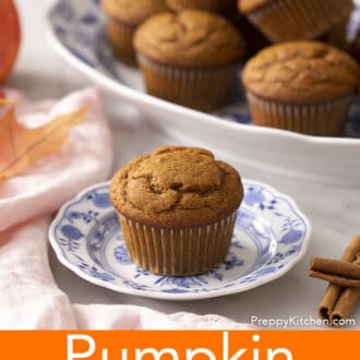 Pinterest graphic of a pumpkin muffin on a blue and white plate with a pile on a platter in the background.