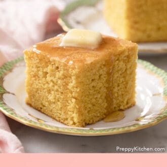 Pinterest graphic of a piece of cornbread dripping with honey.