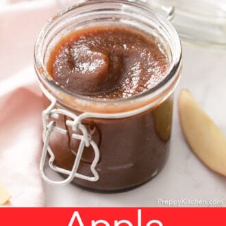 Dark brown apple butter in a glass jar.