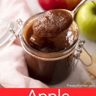 A golden spoon lifting apple butter.