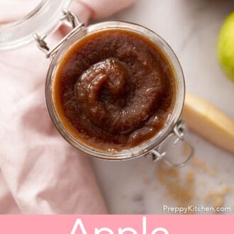 An open jar of apple butter.
