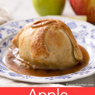 Pinterest graphic of an apple dumpling on a blue and white plate with syrup.