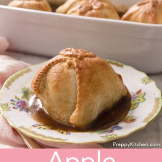 Pinterest graphic of an apple dumpling on a plate with more in the background.