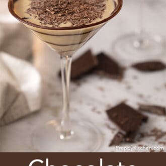 Pinterest graphic of a chocolate martini garnished with shaved chocolate on a marble table..