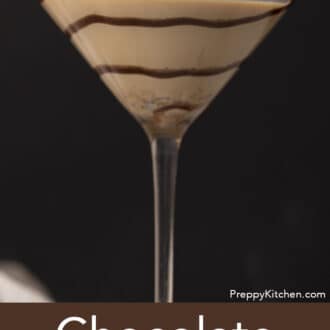 Pinterest graphic of a chocolate martini with a swirl of chocolate syrup.