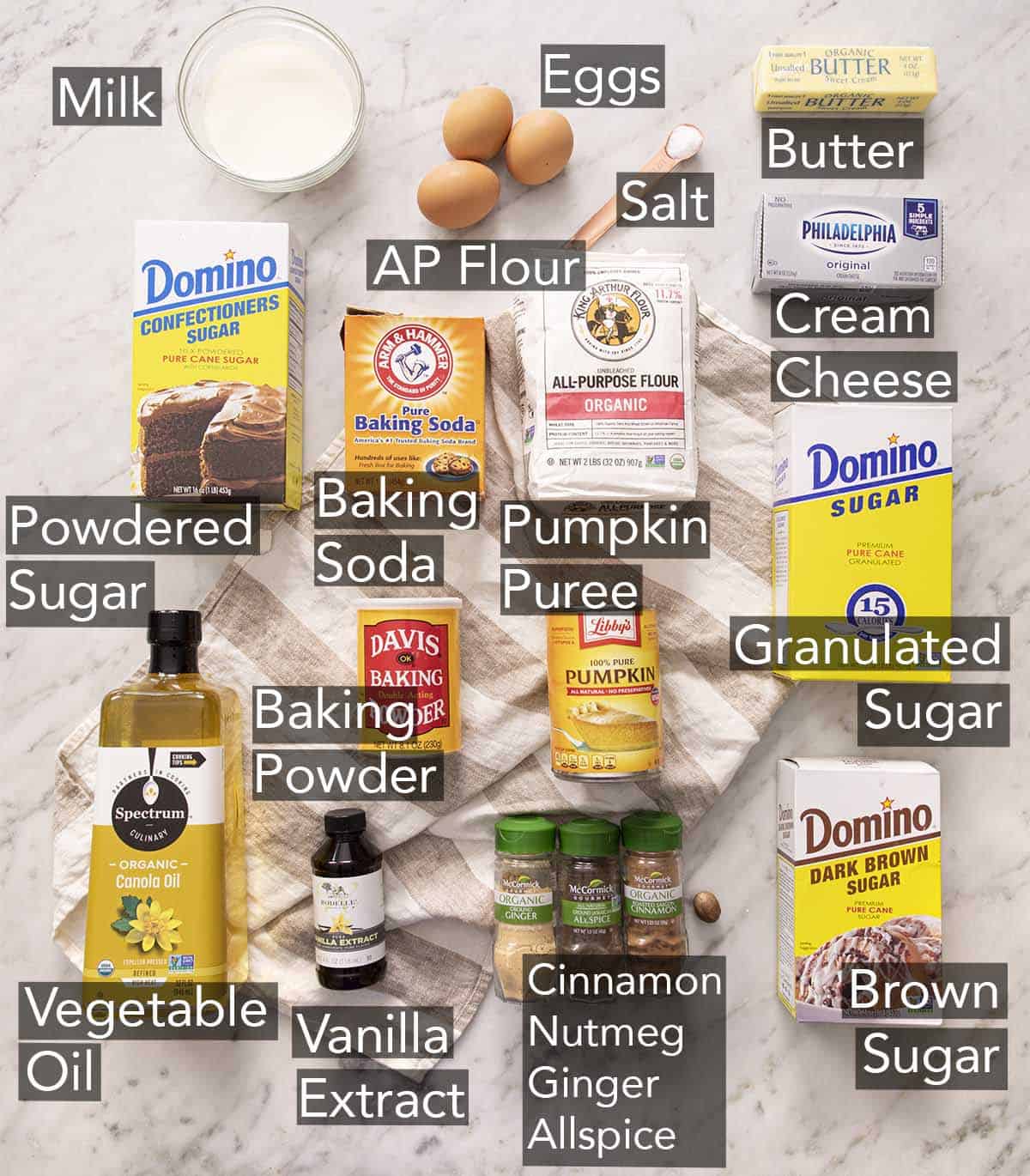 Ingredients for making pumpkin bars on a counter.