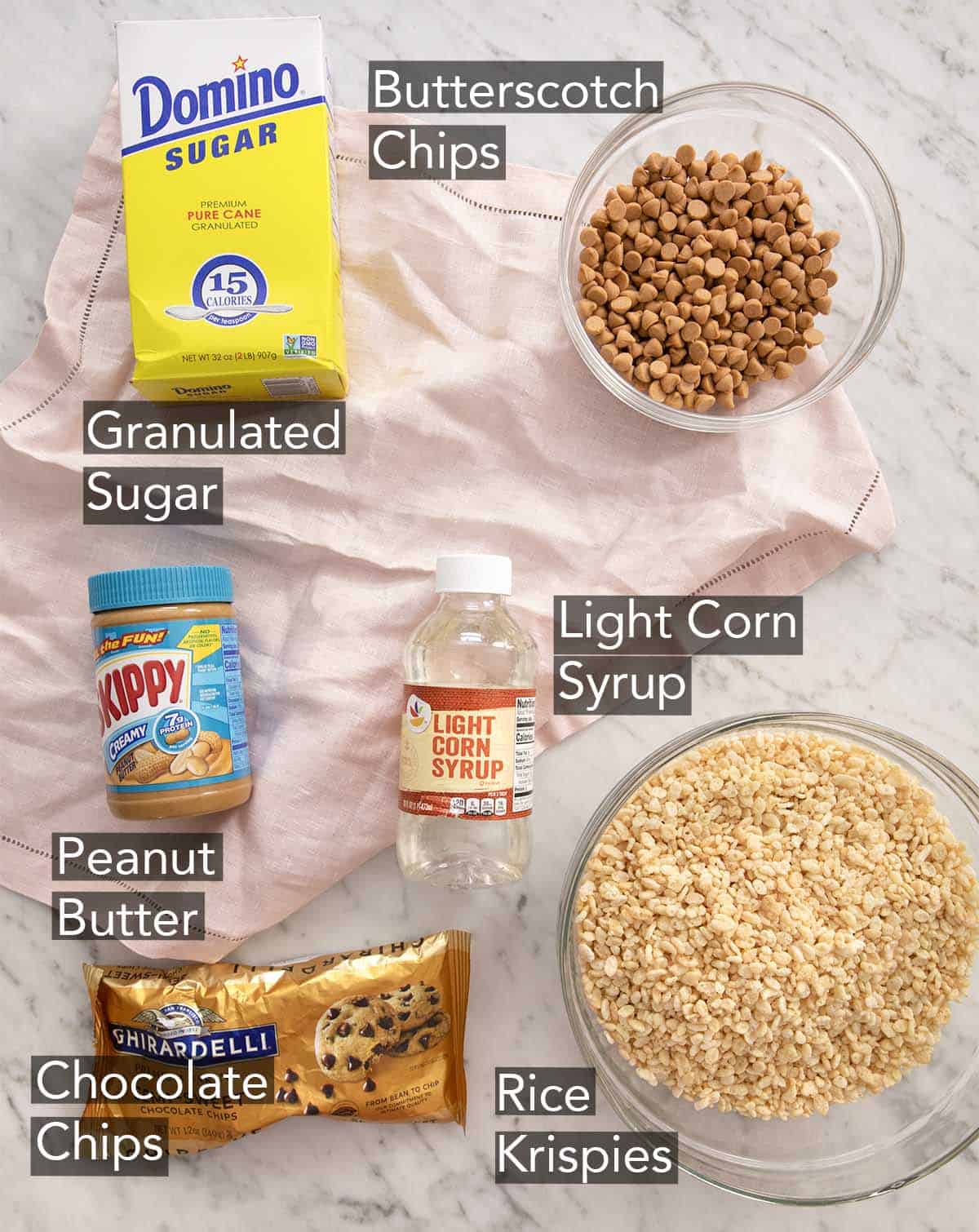 Ingredients to make scotcheroos on a marble counter.