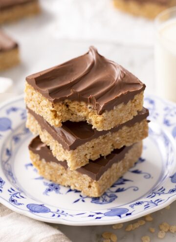 Three scotcheroos on a blue and white plate.