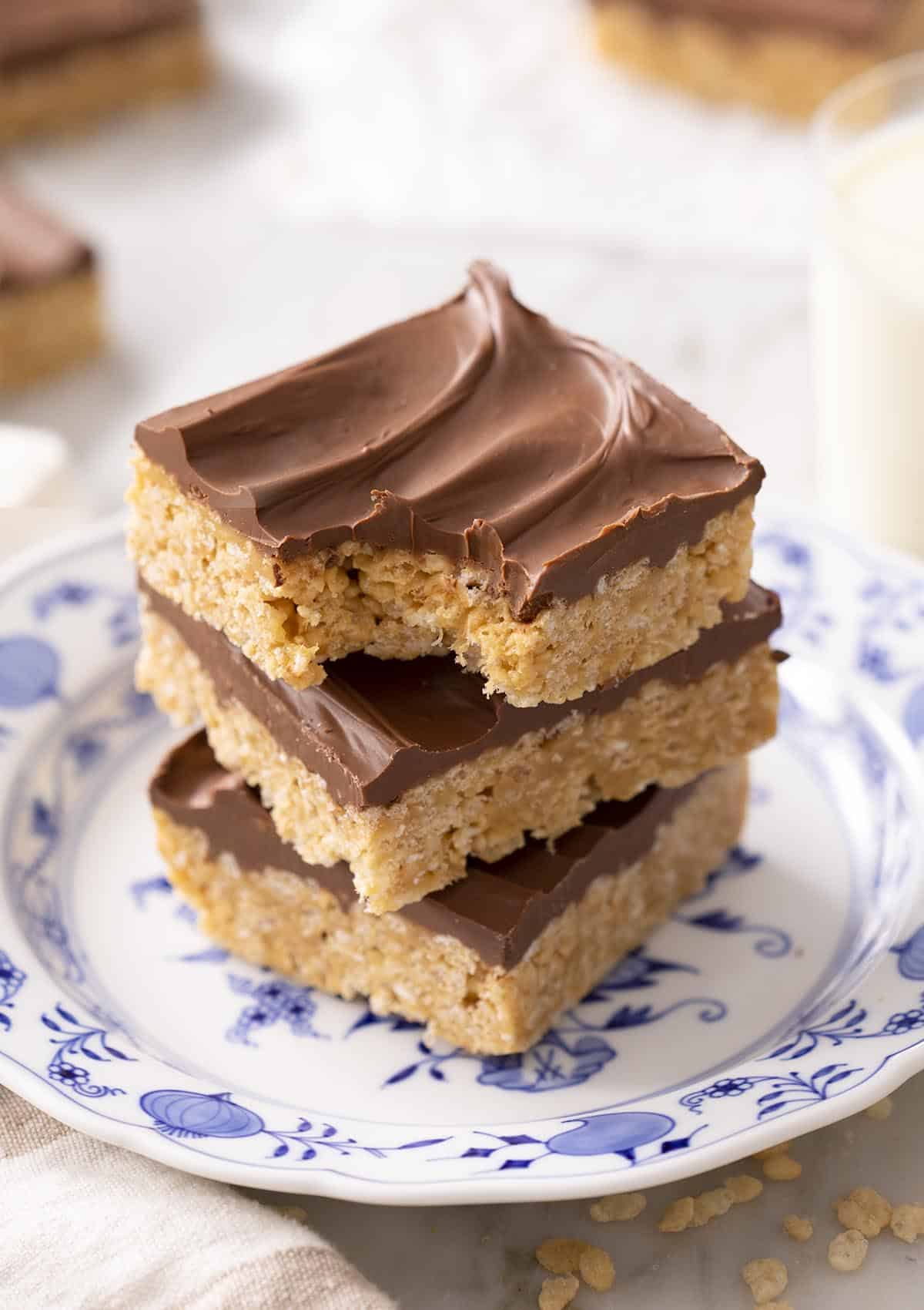 Three scotcheroos on a blue and white plate.
