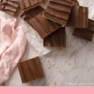 Pinterest graphic of a group of scotcheroos on a marble counter.