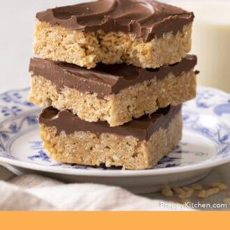 Pinterest graphic of three scotcheroos stacked on a plate.