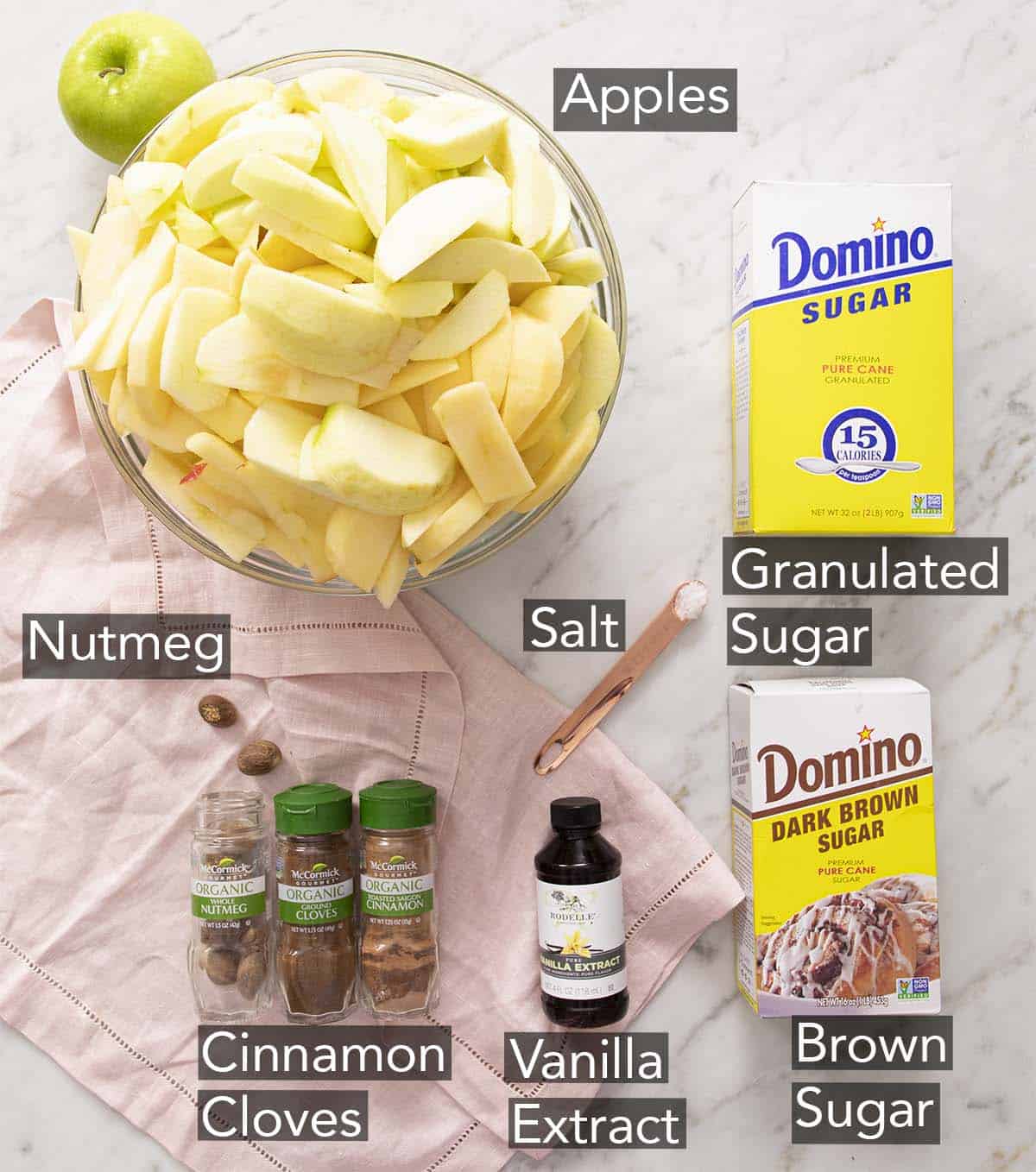 Ingredients for making apple butter on a counter.