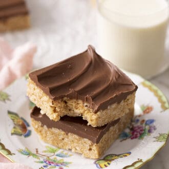 Pinterest graphic of two scotcheroos on a plate.