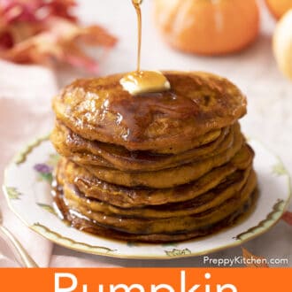Maple syrup pouring on a stack of pumpkin pancakes.