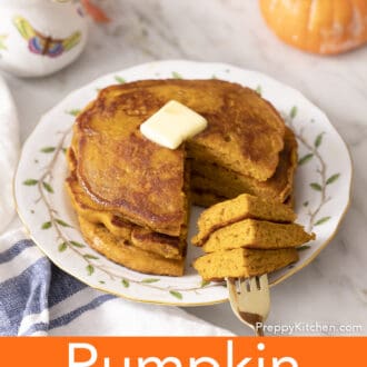 A golden fork with pieces of pumpkin pancakes on it.