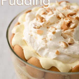 Pinterest graphic of a close up view of a banana pudding in a glass trifle dish.