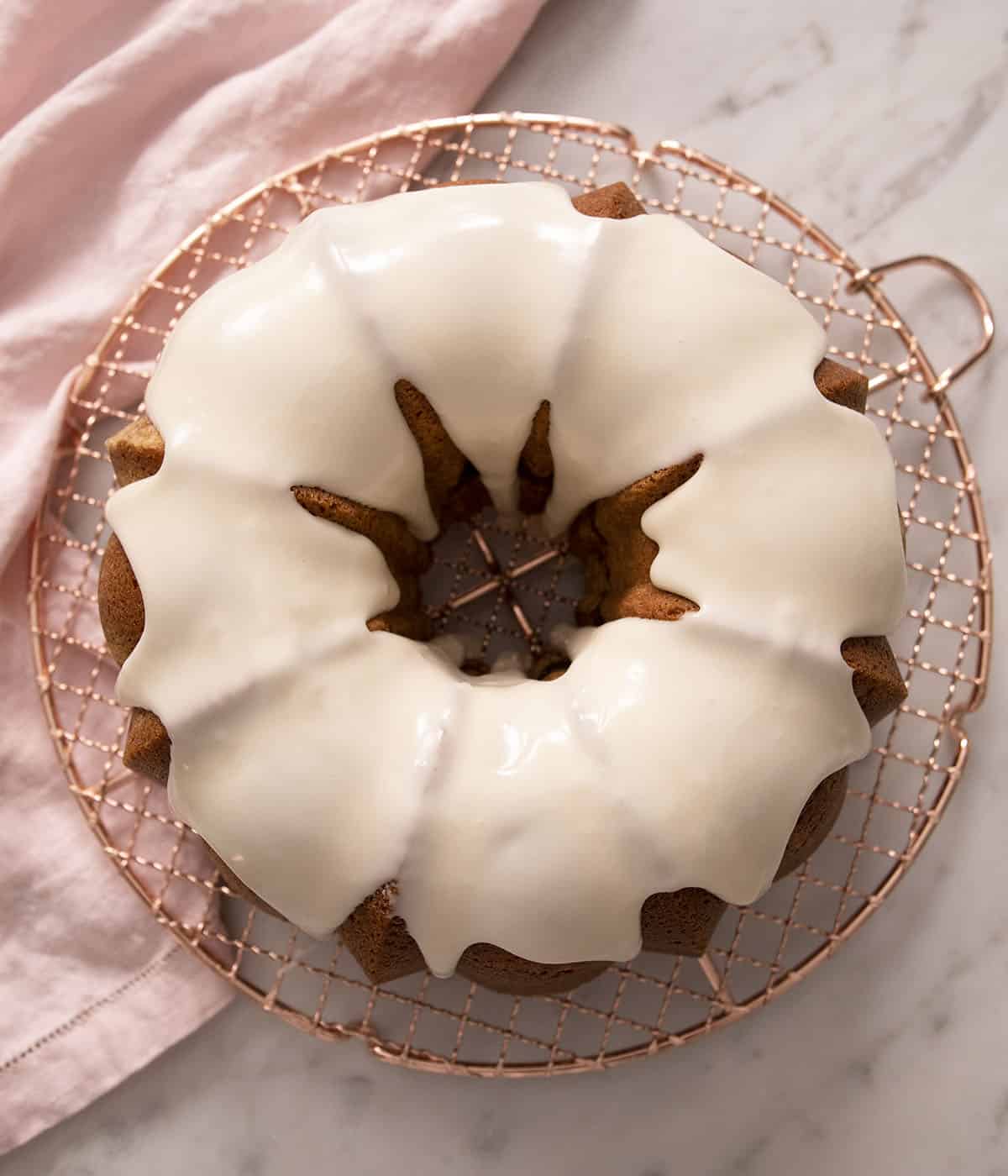 A top down photo of a sock it to me cake with vanilla icing.