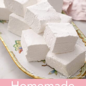 Pinterest graphic of several cubed marshmallows on a floral platter with a pink napkin.