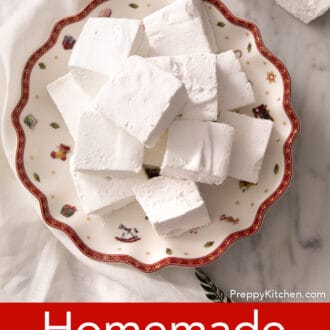 Pinterest graphic of an overhead view of several square marshmallows stacked on a festive platter.