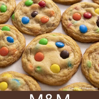Pinterest graphic of several M&M Cookies on a counter in a grid configuration.