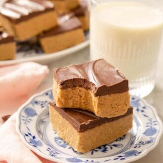 A Pinterest graphic a stack of 2 peanut butter bars. The top one has a bite out.