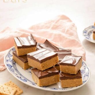 A Pinterest graphic showing no-bake chocolate peanut butter bars on a platter.